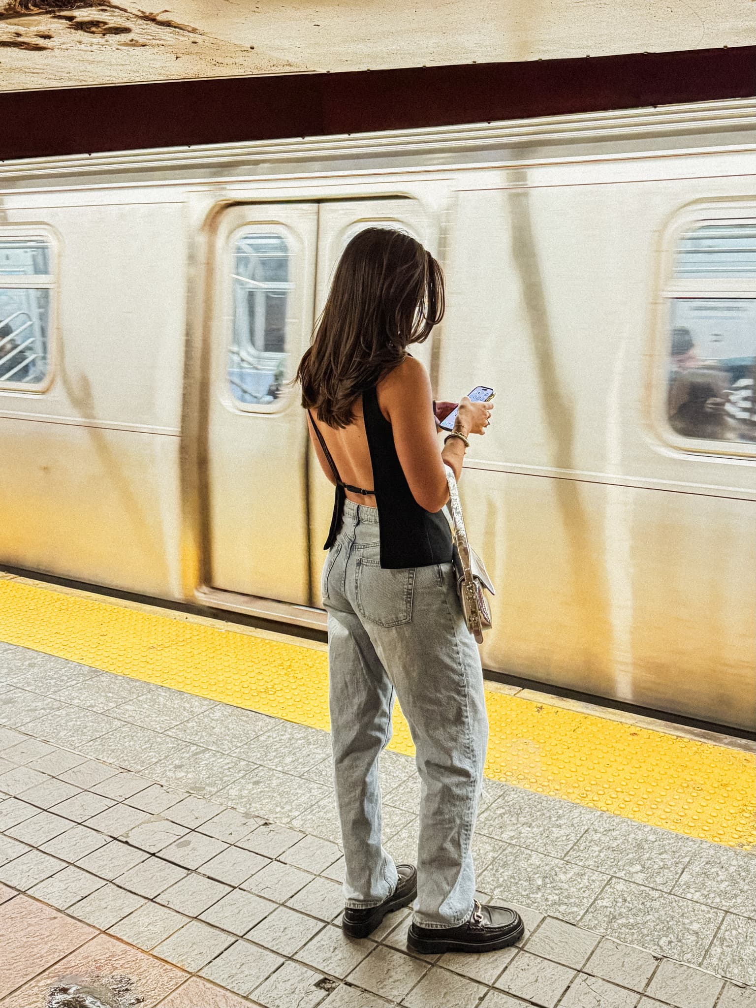 Woman on NYC subway platform